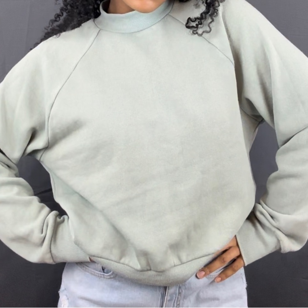 Mint green mock neck sweatshirt in size large.